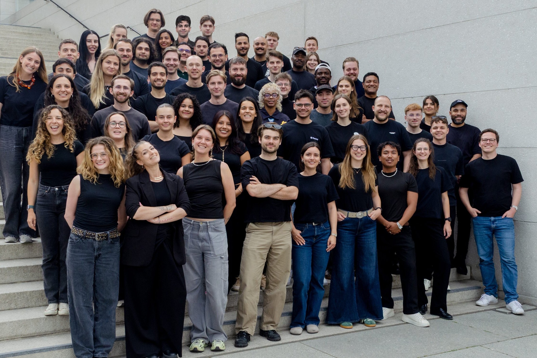 The Reonic team on the steps outside the office